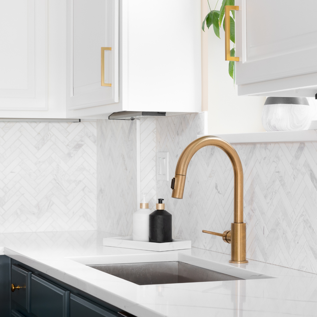 beautiful kitchen with marble tiles and copper tapware